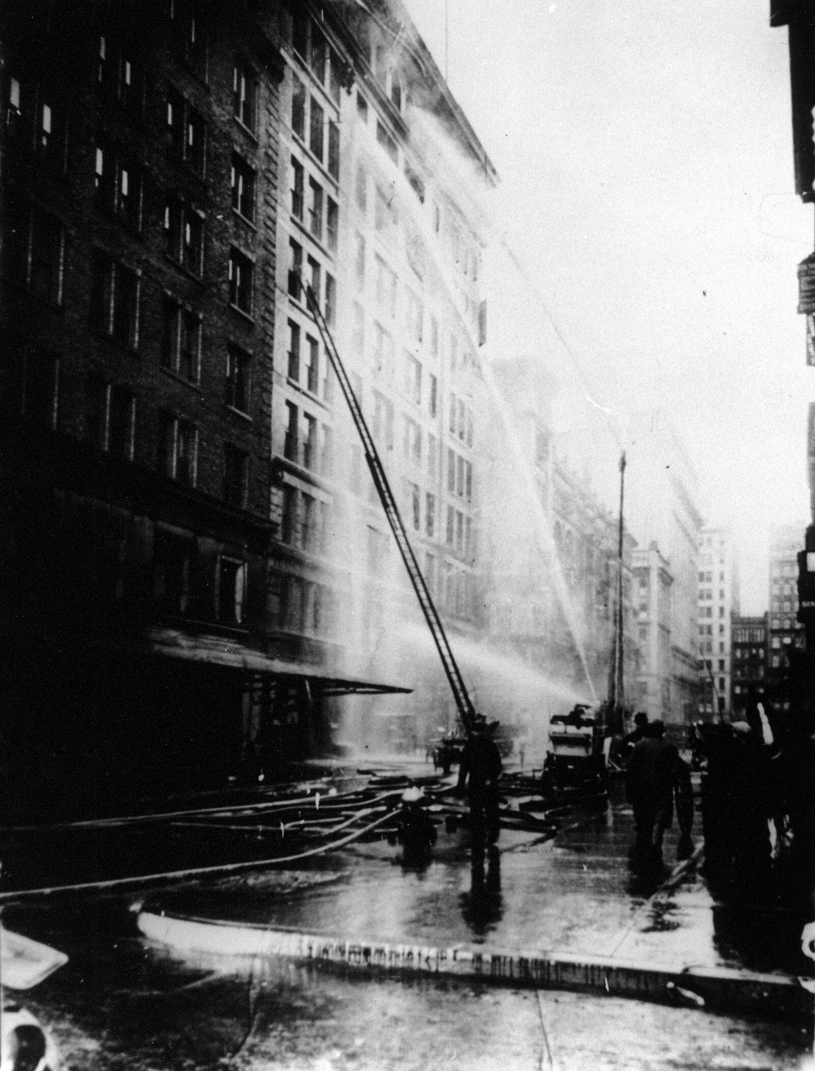 Title:  Firefighters spray water on the Asch Building trying to put out the Triangle factory fire blaze, March 25, 1911
 
             Date: